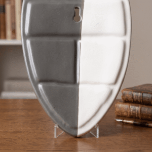 Back view of ceramic face wall planter showing flat mounting surface and hanging hole