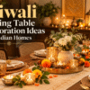 Diwali dining table decorated with a floral centrepiece, decorative trays, candles and festive table accessories