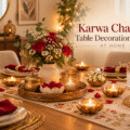 Elegant Karwa Chauth table decoration at home with a red and cream table runner, floral centrepiece and warm lighting.