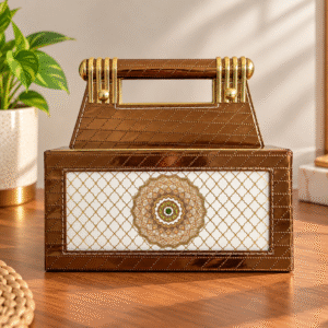Brown and gold organizer with handle and decorative mandala front panel on a wooden tabletop
