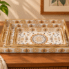 Set of three wooden serving trays arranged together with matching floral mandala patterns